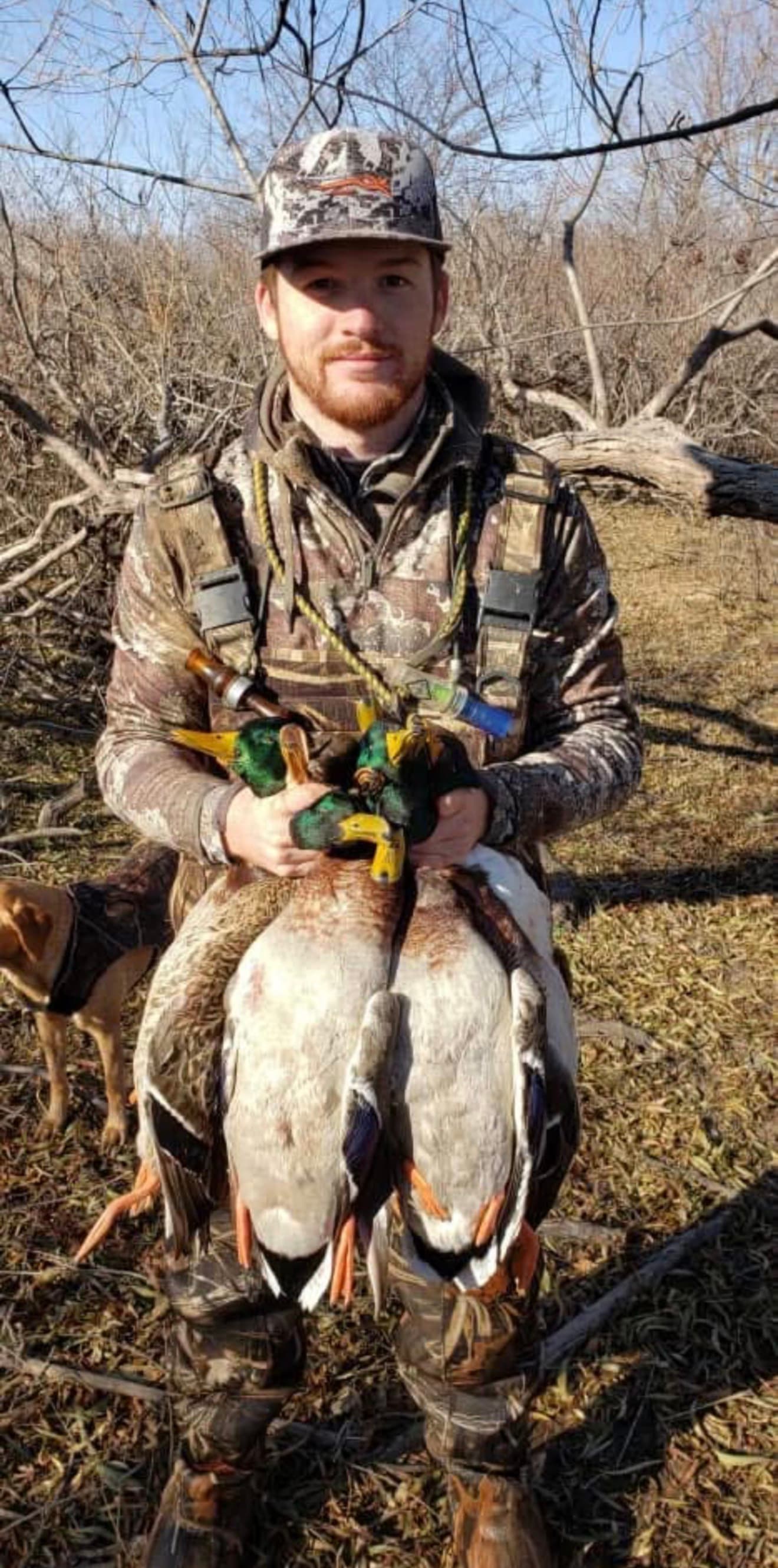 Eyan Curtis, co-founder of Prairie Haven Outdoors, holding a pair of drake mallards